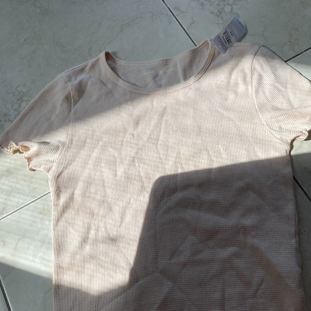 Brown American eagle shirt.